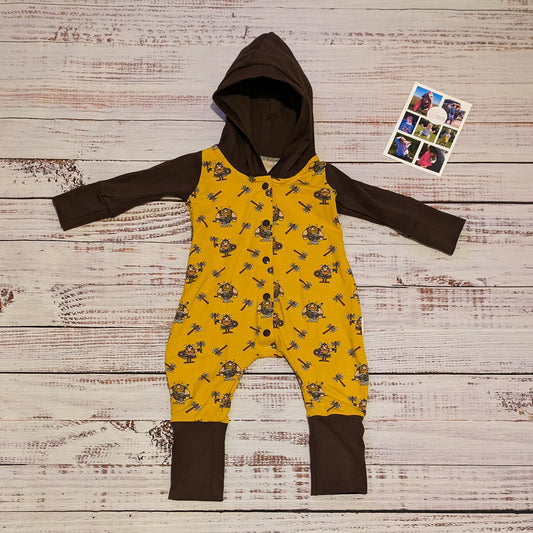 The fun and adorable mustard Vikings, hooded popper romper. Shown with long sleeves. Lovingly handmade in mustard Vikings and chocolate cotton jersey's.