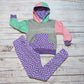 The fabulous purple trippy checked hoodie. Handmade using purple trippy checked cotton jersey, mint, pink and grey cotton French terry and purple cotton ribbing. Shown with purple trippy checked leggings.