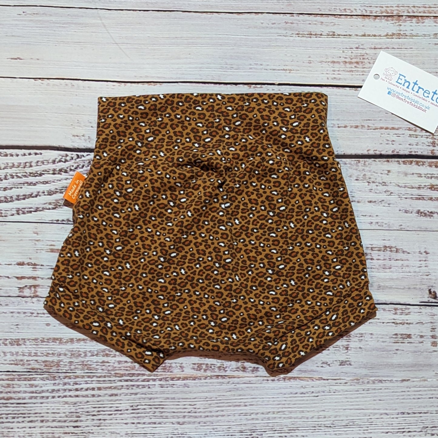 Soft and comfy kids shorts, handmade using the stylish camel leopard print cotton jersey. Shown from the rear.
