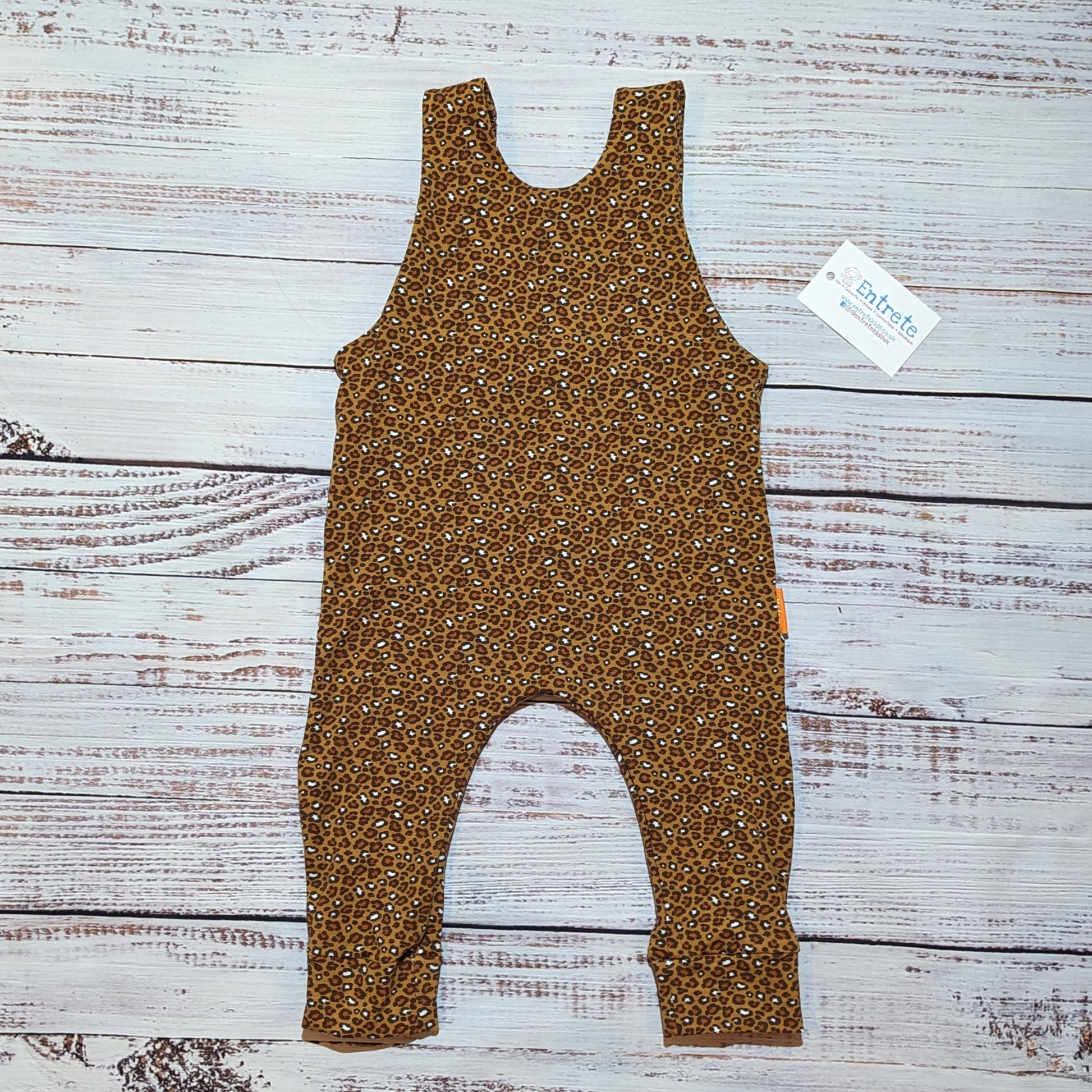 The stylish camel leopard print sleeveless romper. Handmade using soft and comfortable organic cotton jersey. Shown from the rear.