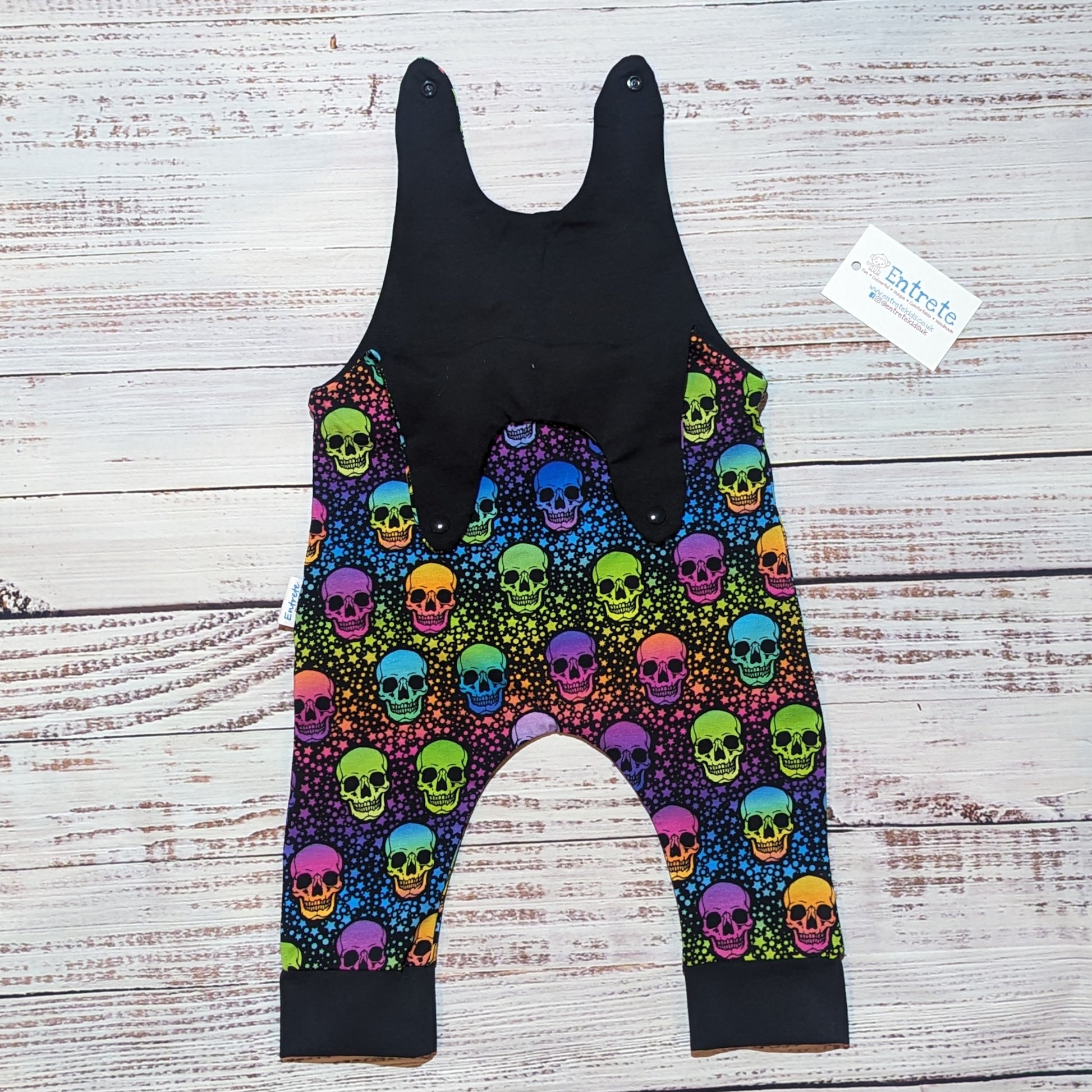 The adorably colourful neon skulls sleeveless romper. Hanmade using soft and comfortable cotton jersey. Shown with the shoulder popper entry open.