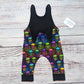 The adorably colourful neon skulls sleeveless romper. Hanmade using soft and comfortable cotton jersey. Shown with the shoulder popper entry open.