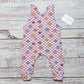 Pink checked happy flowers sleeveless romper. With shoulder popper entry and roll-able ankle cuffs. Handmade in soft and comfy cotton jersey. Shown from the rear.
