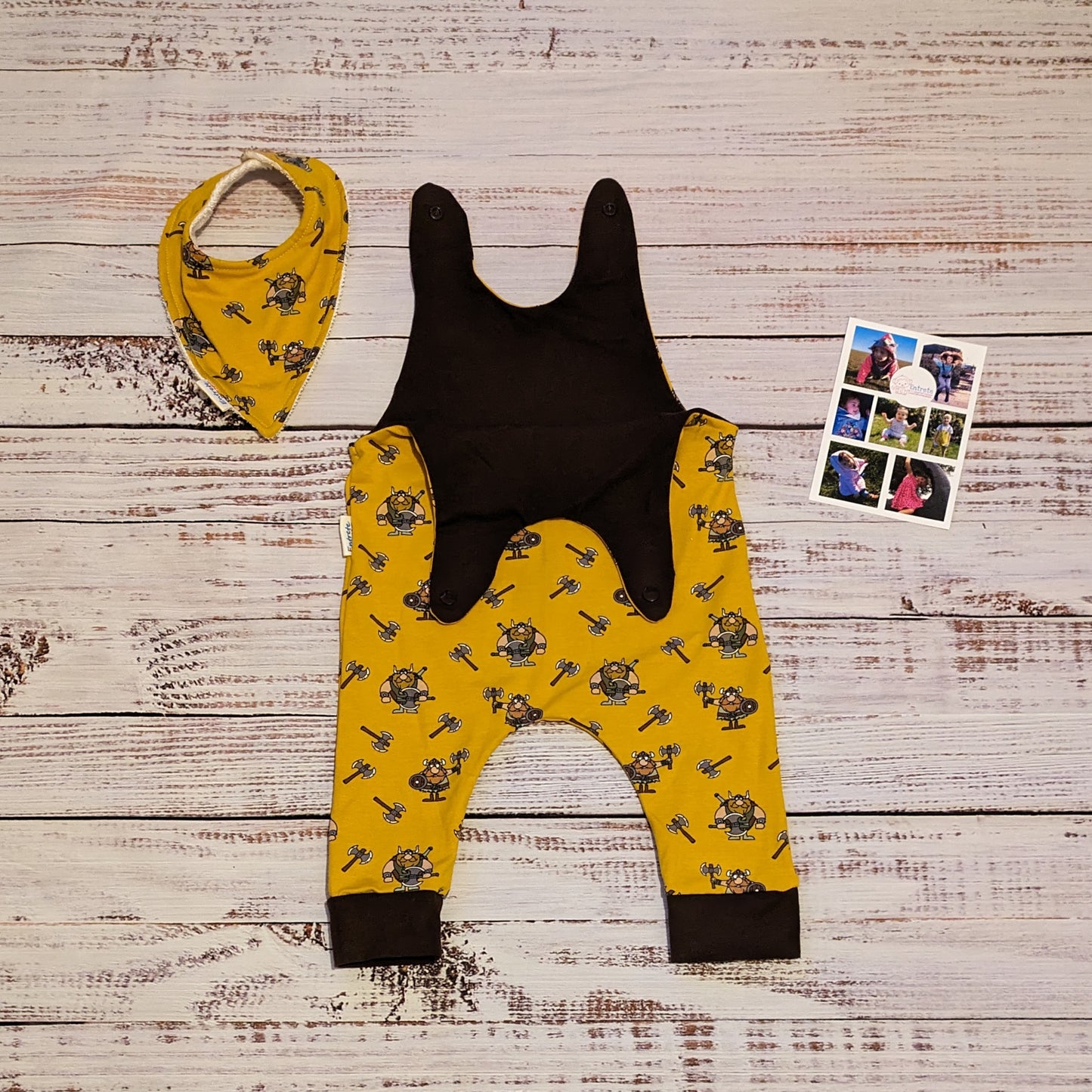 The soft, comfy and fun mustard Vikings sleeveless romper. Shown with the shoulder popper entry open and a matching bamboo bib. Lovingly handmade using mustard Vikings and chocolate cotton jersey's.