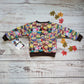 The vibrant and fun colourful cartoon owl sweatshirt. Handmade using colourful owls cotton sweatshirt fleece and chocolate cotton ribbing. Shown from the rear.