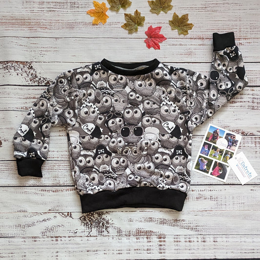Fun, black and white cartoon owl sweatshirt. Handmade using warm monochrome owls cotton sweatshirt fleece and black cotton ribbing.