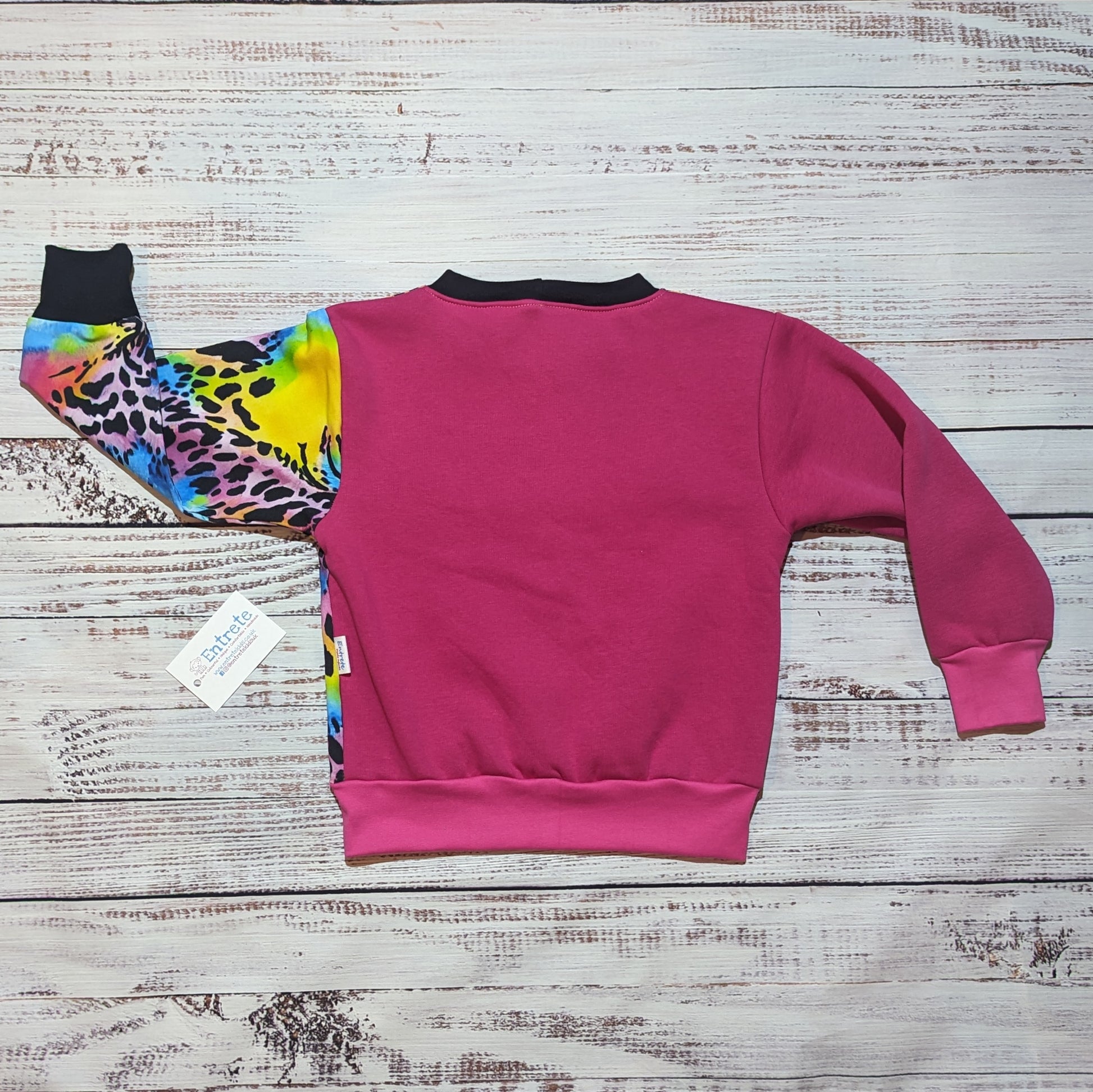 Rear of the fuchsia and neon animal print sweatshirt. With contrasting arms.