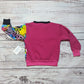 Rear view of the vibrant fuchsia and neon animal print sweatshirt. With contrasting fuchsia and black ribbing.