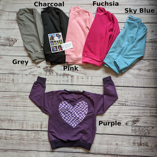 The fun purple trippy checked heart sweatshirt. With its heart design on the back and a choice of colours.