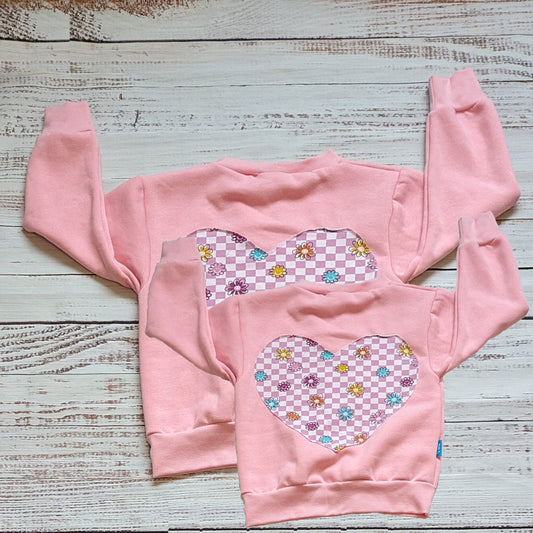 The adorable pink checked happy flowers heart Mama and mini sweatshirt set. With heart detailing to the rear.
