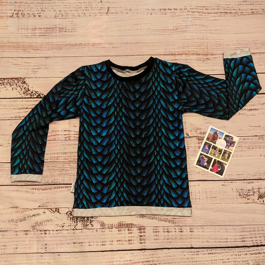 The gorgeous glimmering dragon scales T-shirt. Handmade using dragon scales cotton French terry and black cotton ribbing. Showing the long sleeve version.