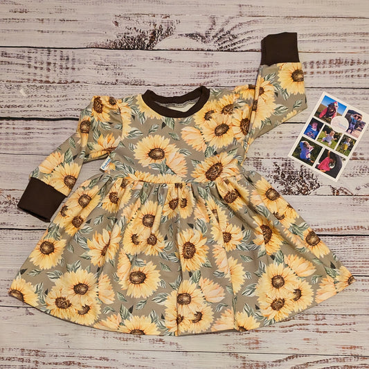The fabulous sunflower sweater dress handmade using sunflowers cotton French terry and chocolate cotton ribbing.
