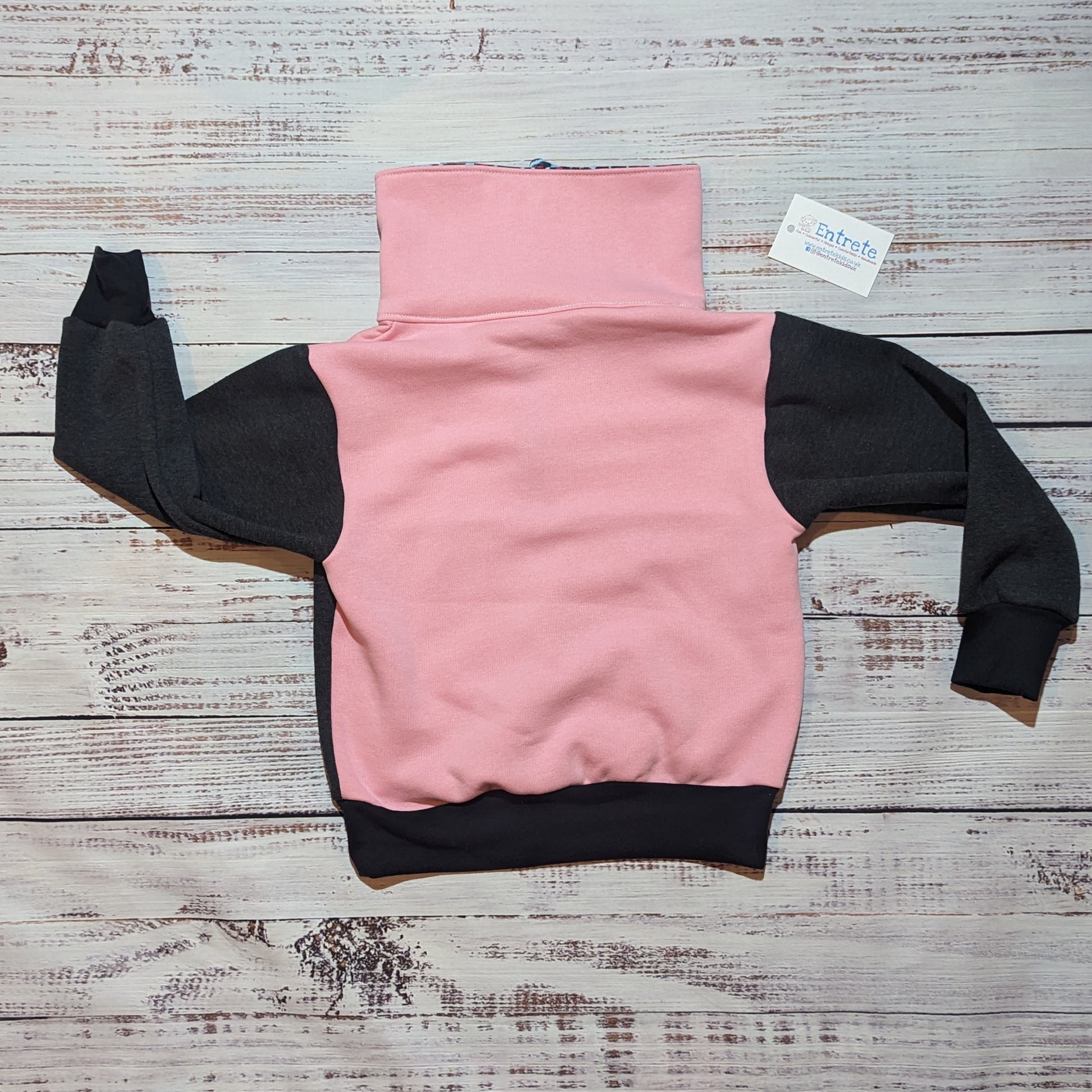 The vibrant neon leopard print zip sweatshirt. Handmade using soft and comfortable Cotton French terry and cotton ribbing. Shown from the rear.