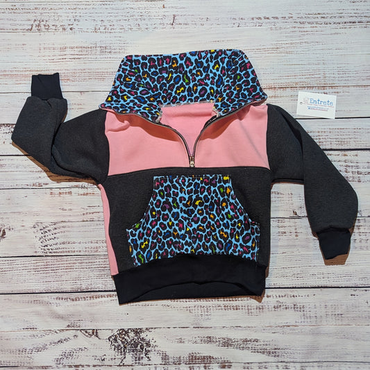 The vibrant neon leopard print zip sweatshirt. Handmade using soft and comfortable Cotton French terry and cotton ribbing. Shown with the zipped collar open.