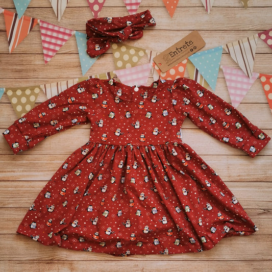Girls Christmas dress, handmade using the festive and fun red penguins cotton jersey. Shown with a matching headband (sold separately)