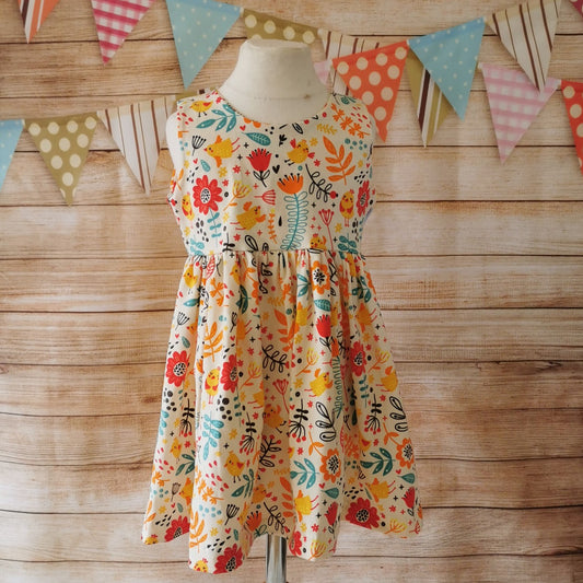 Front of Girls Sleeveless Back Popper Dress, handmade using the fun cream chicks cotton jersey.