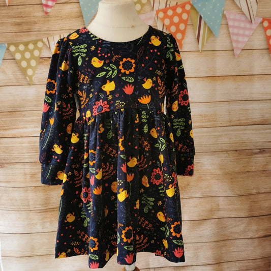 Long Sleeved girls back popper dress, handmade from the cute navy chicks cotton jersey.