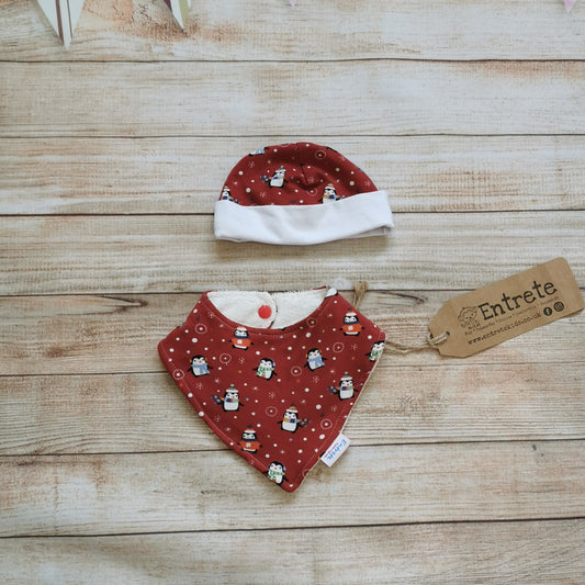 Fun and festive red penguins bamboo bib and babies hat gift set. Handmade using red penguins and white cotton jerseys and absorbent natural bamboo on the bib. A great Christmas gift!