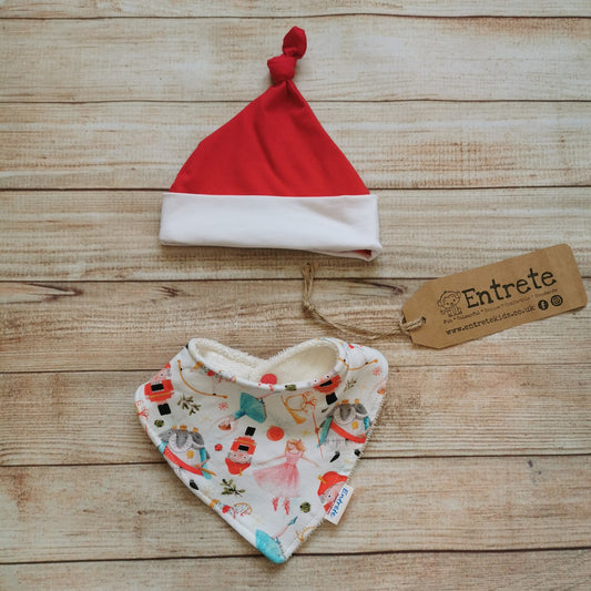 Christmas Nutcracker bamboo bib and babies hat gift set. Handmade using white nutcracker, red and white cotton jerseys and absorbent natural bamboo on the bib. A great Christmas gift!