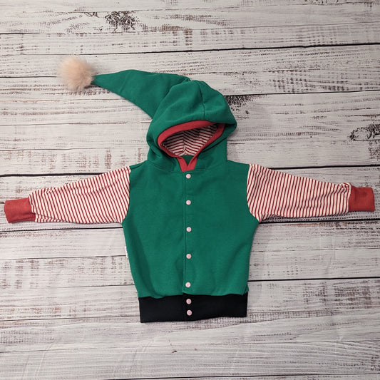 Fantastically fun reversible elf hoodie. Handmade in green cotton sweatshirt fleece, with red striped cotton jersey arms, graphite ribbing waist and red ribbing cuffs . With adorable pom-pom hood.
