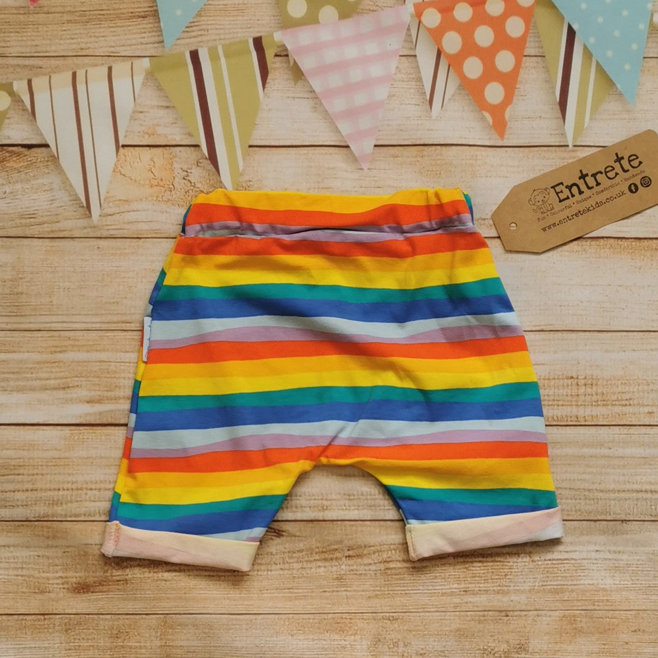 Rear of red rainbow striped cotton jersey shorts.