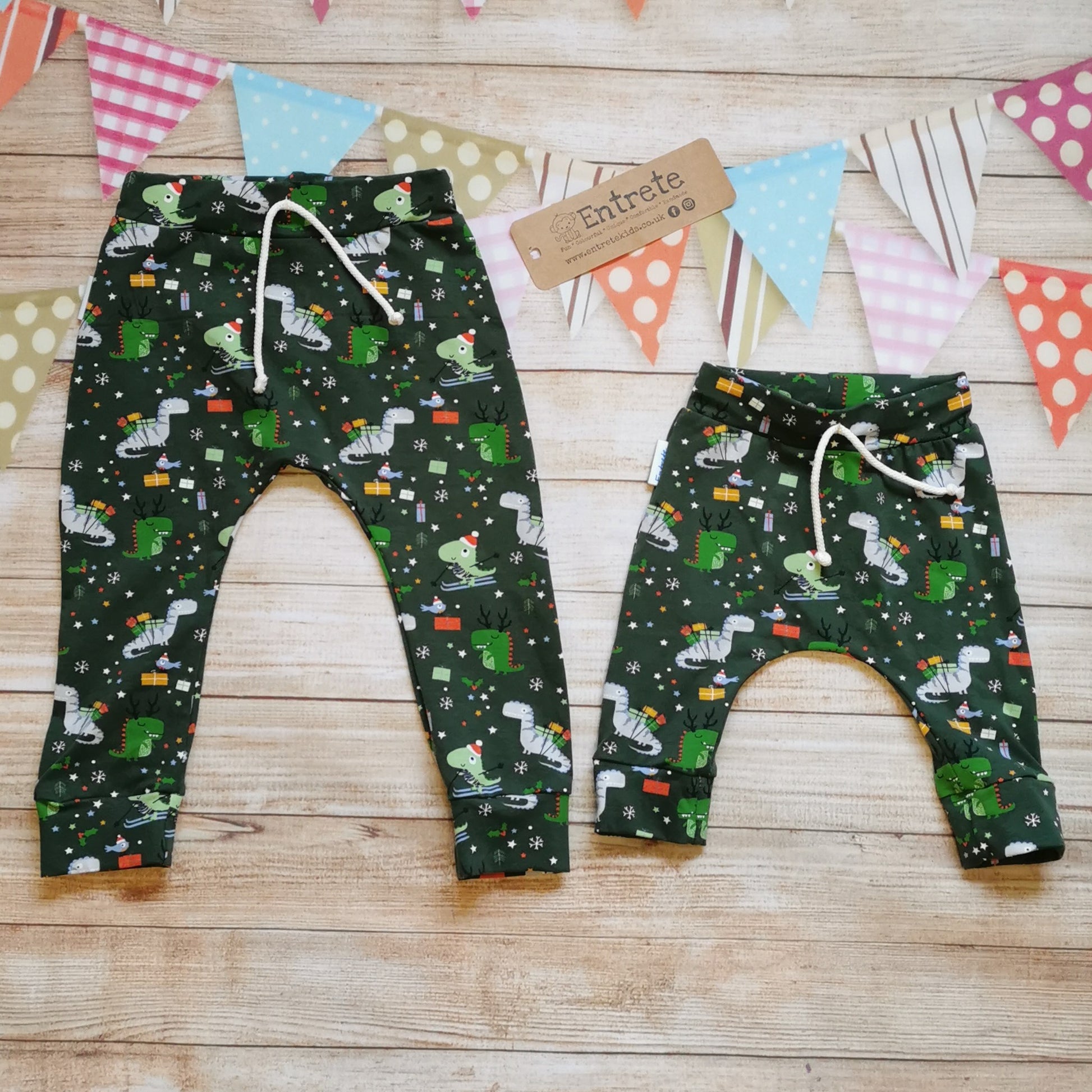 Harem joggers with elasticated waist, dropped crotch and roll-able ankle cuffs. Handmade in dark green festasaurus cotton jersey. Perfect for your little dinosaur fanatic! Shown as a matching set (you are buying one pair of harem joggers)