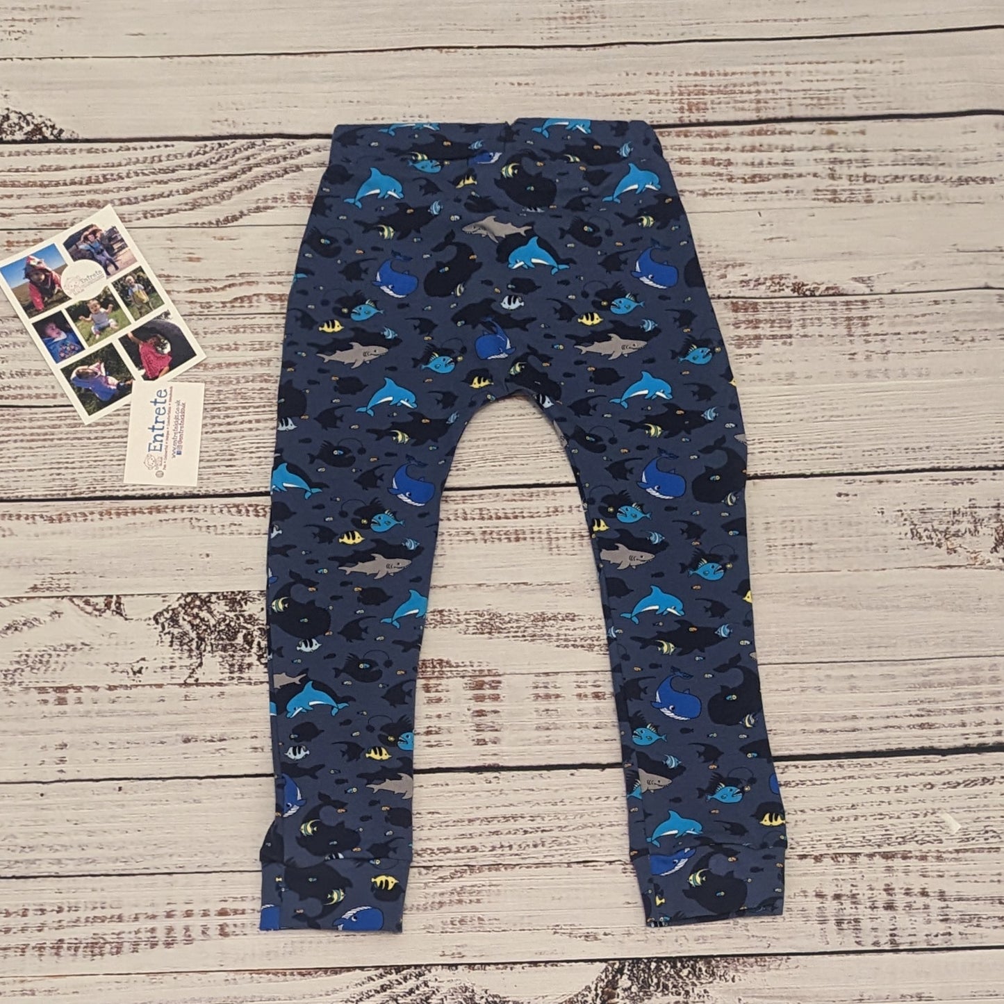 Kids navy sea creatures harem joggers. Handmade using navy sea life shadows cotton jersey. Shown from the rear.