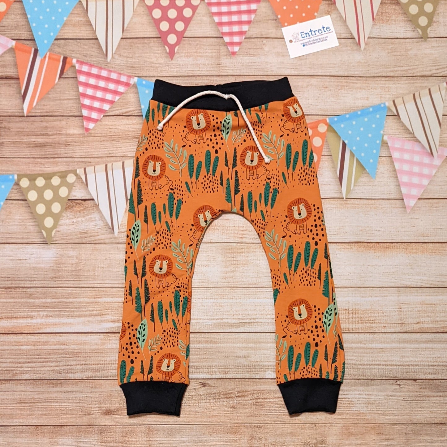 The fun and ferocious orange Lions harem joggers. Handmade using orange Lions cotton French terry and black cotton ribbing.