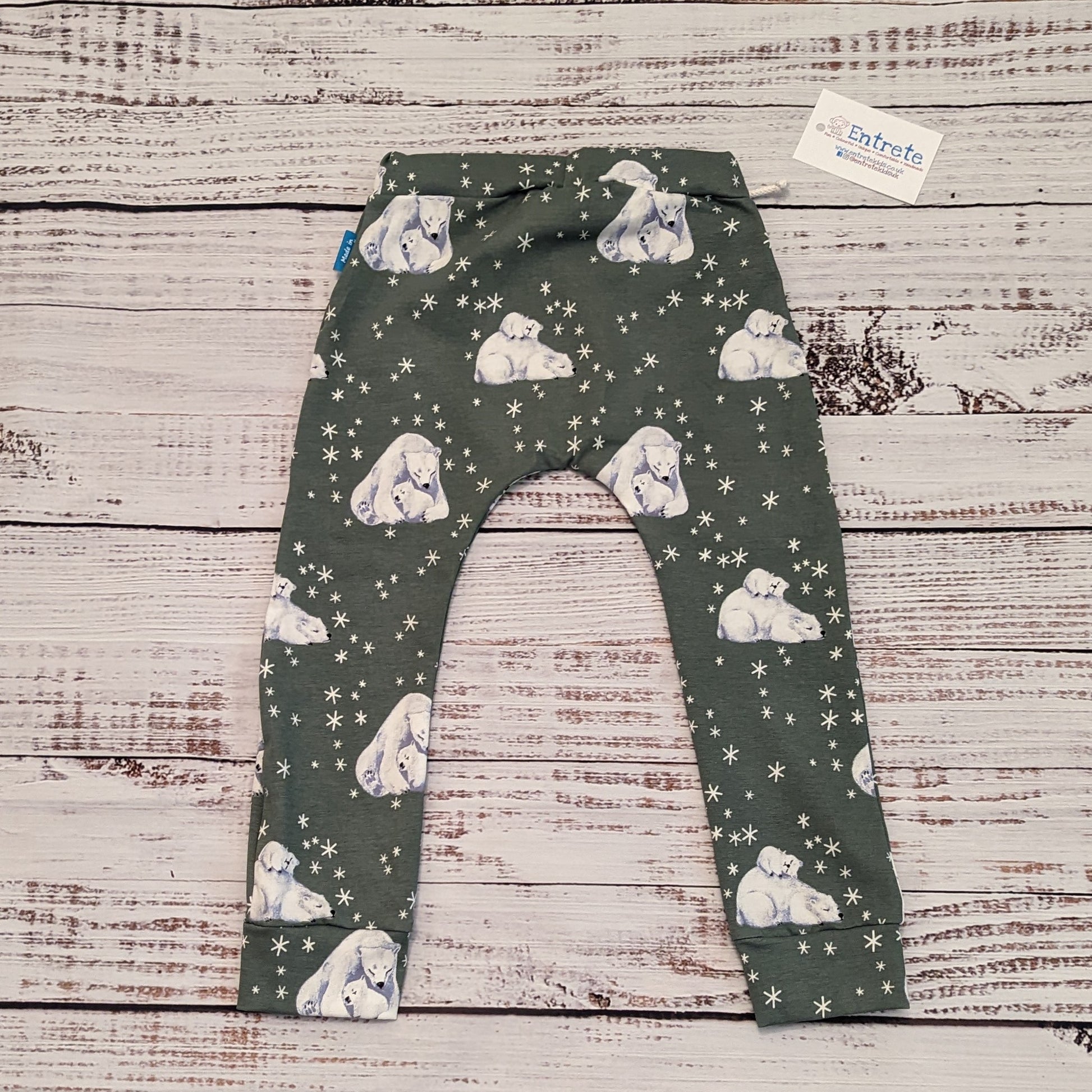 Soft and comfy harem joggers, featuring an elasticated waist, perfect for active kids. Handmade using polar bears cotton jersey. Rear view.