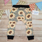 Pretty sunflowers harem joggers, handmade using sunflowers cotton French terry and black cotton ribbing. Shown from the rear.