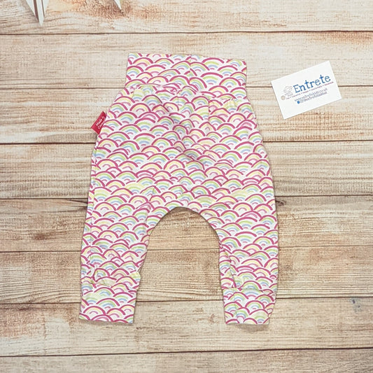 The adorable mini rainbows harem pants with a soft non elasticated waist, perfect for younger children. Handmade using mini rainbows on white cotton jersey.