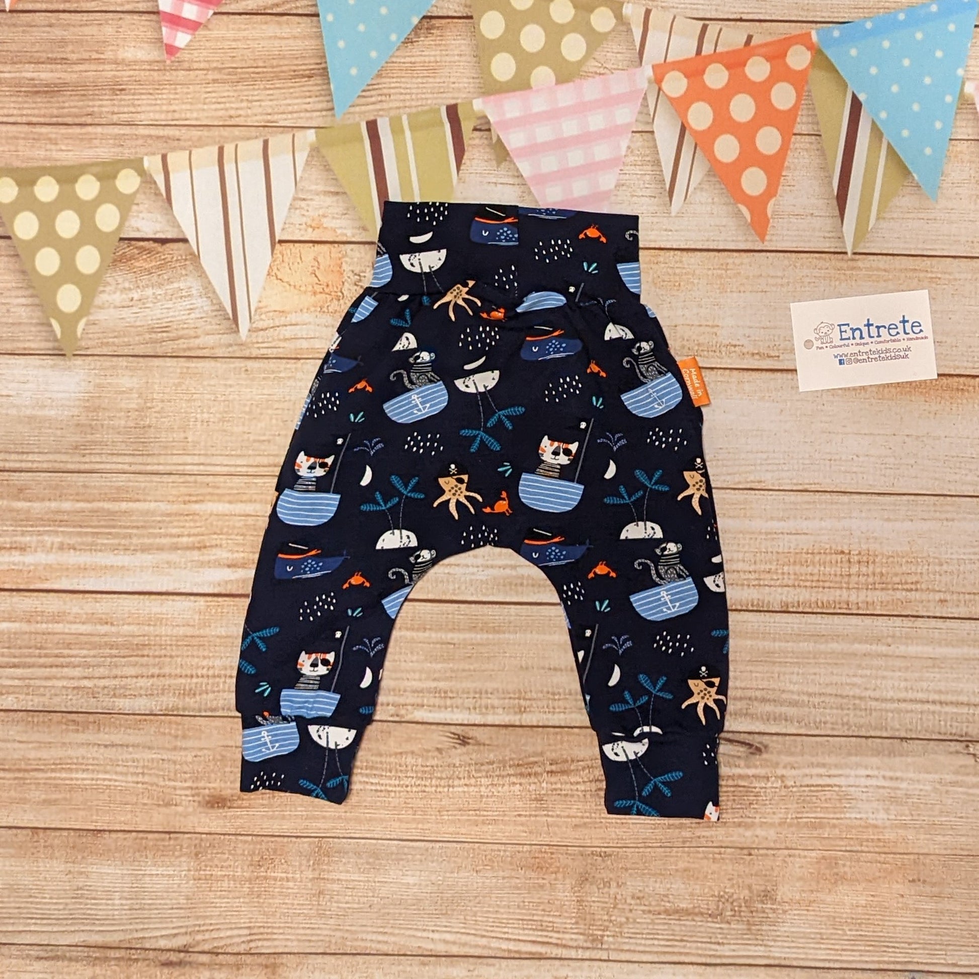 Fun and adventure await, with the pirate cats harem pants. Shown from the rear. Handmade using pirate cats cotton jersey.