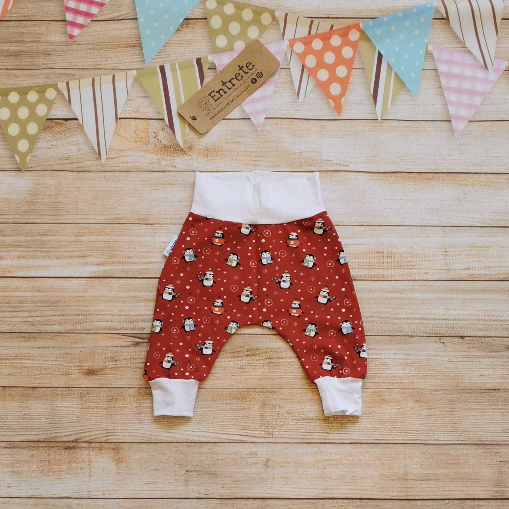 Super comfy harem pants in a fun Christmas design. Handmade using red penguins cotton jersey and white cotton jersey.