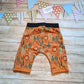 Rear of the roar-some ferocious orange Lions harem shorts. Handmade using orange Lions cotton French terry and black cotton ribbing.