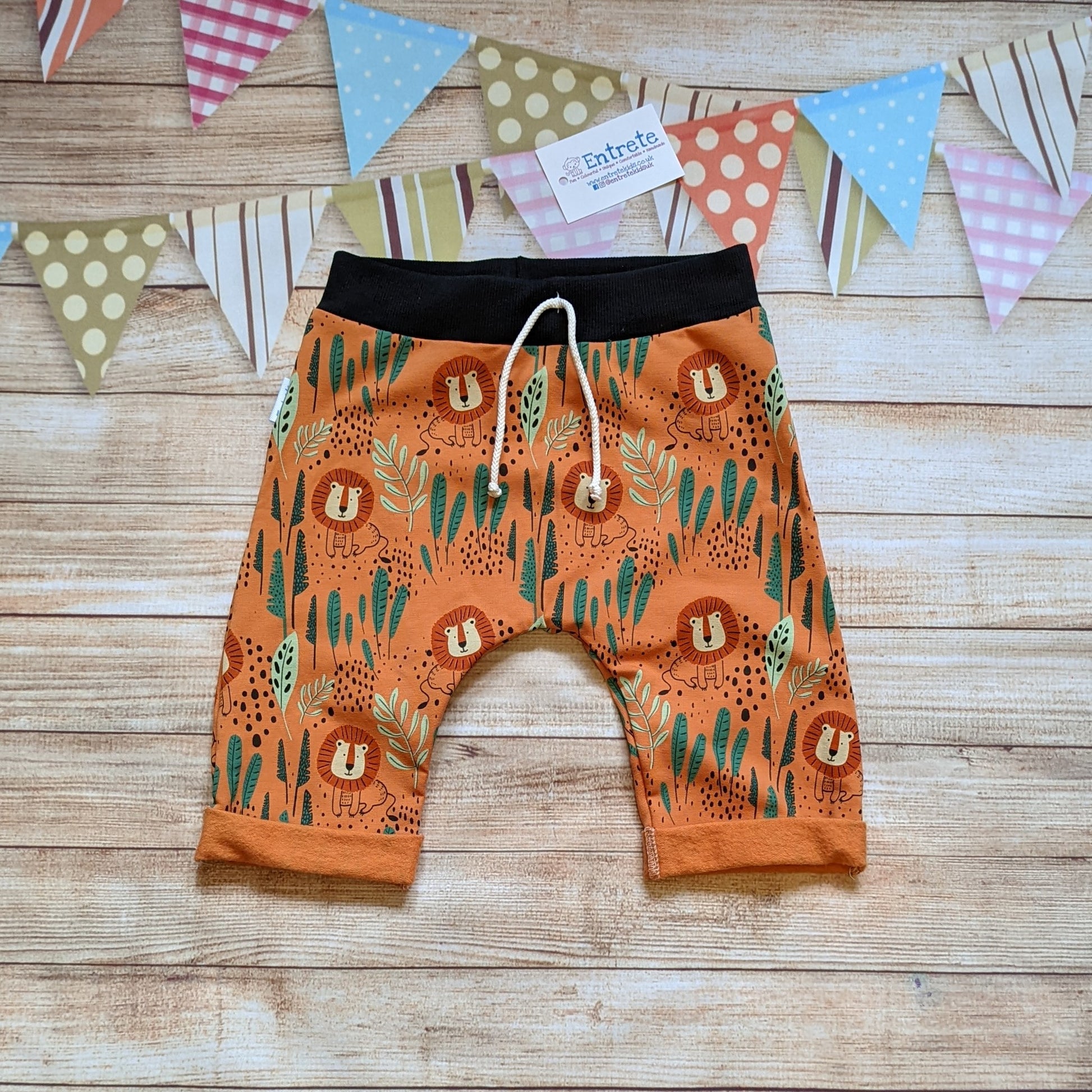 The roar-some ferocious orange Lions harem shorts. Handmade using orange Lions cotton French terry and black cotton ribbing.