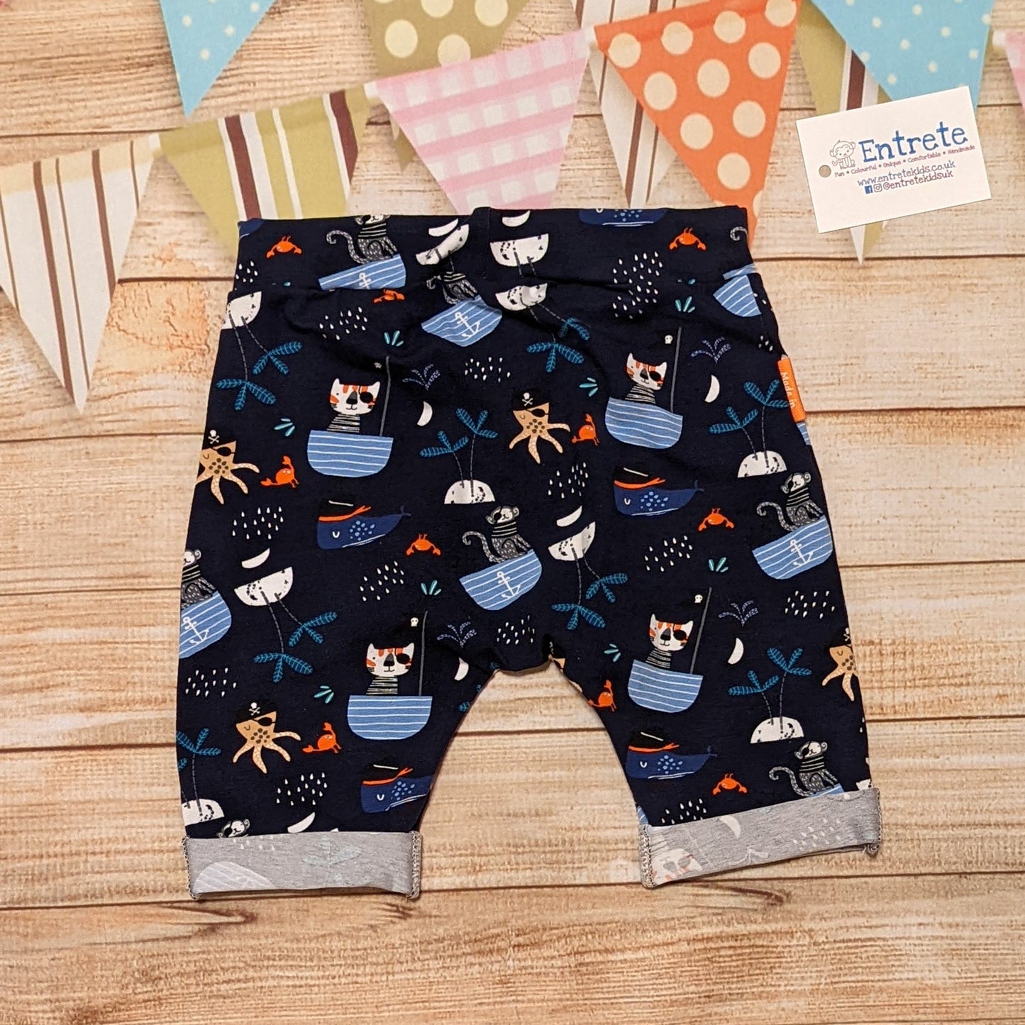 Fun and adventure await, with the pirate cats harem shorts. Shown from the rear. Handmade using pirate cats cotton jersey.