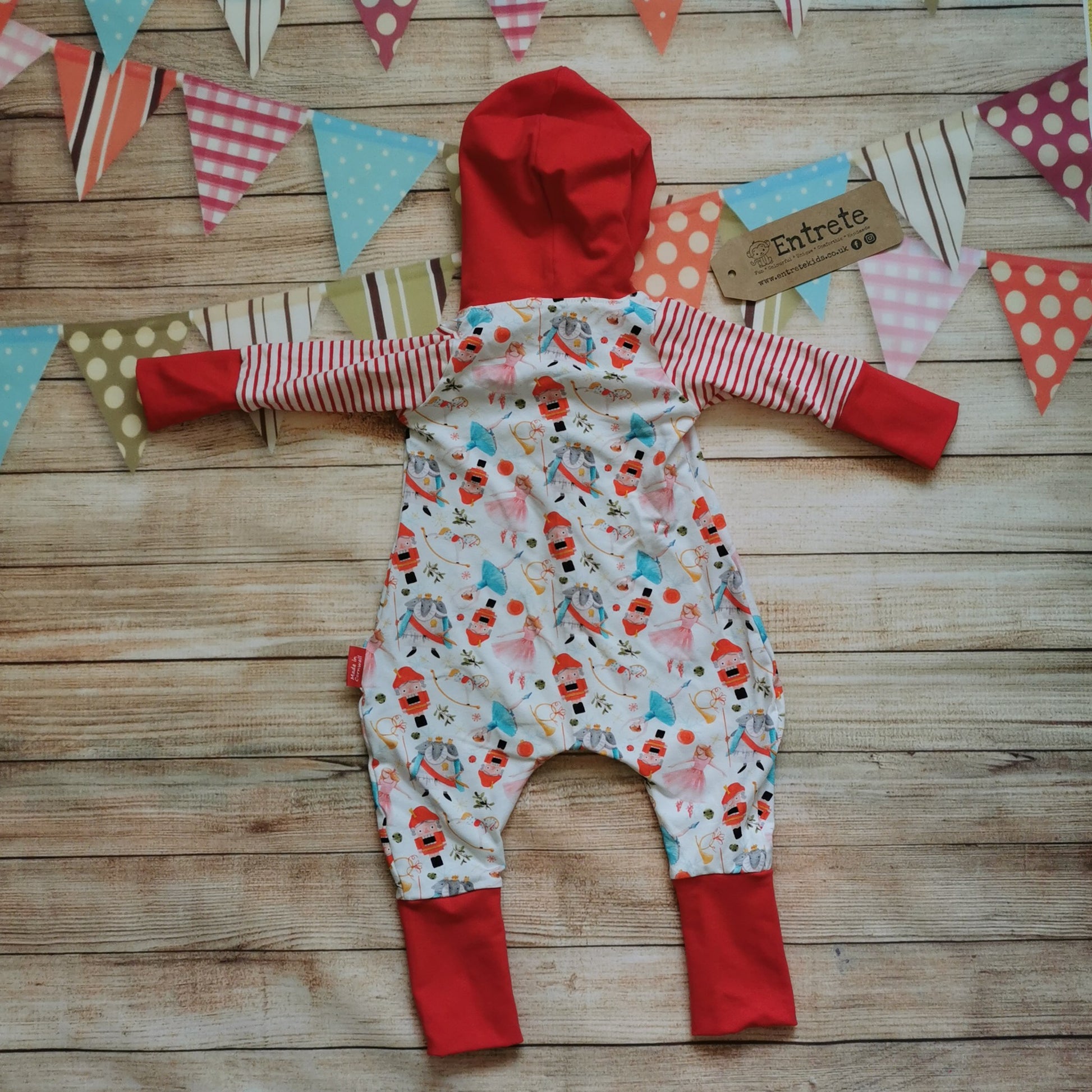 Rear of the gorgeous Christmas nutcracker hooded popper romper. Handmade using white nutcracker, red striped and red cotton jerseys for the perfect Christmas loungewear!