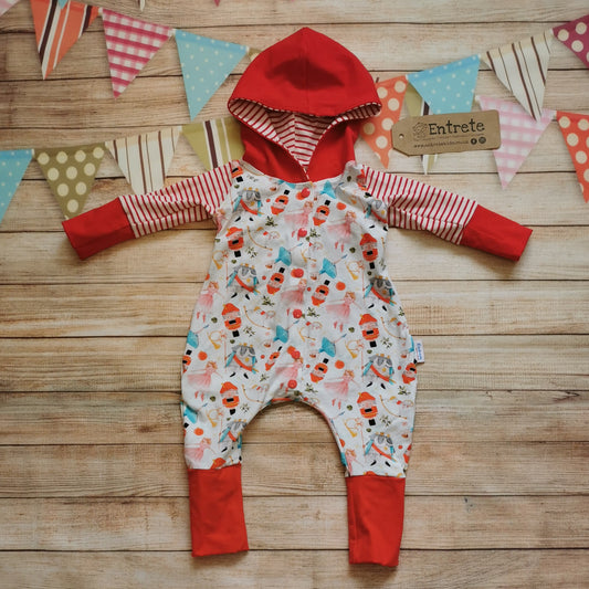 The gorgeous Christmas nutcracker hooded popper romper. Handmade using white nutcracker, red striped and red cotton jerseys for the perfect Christmas loungewear!