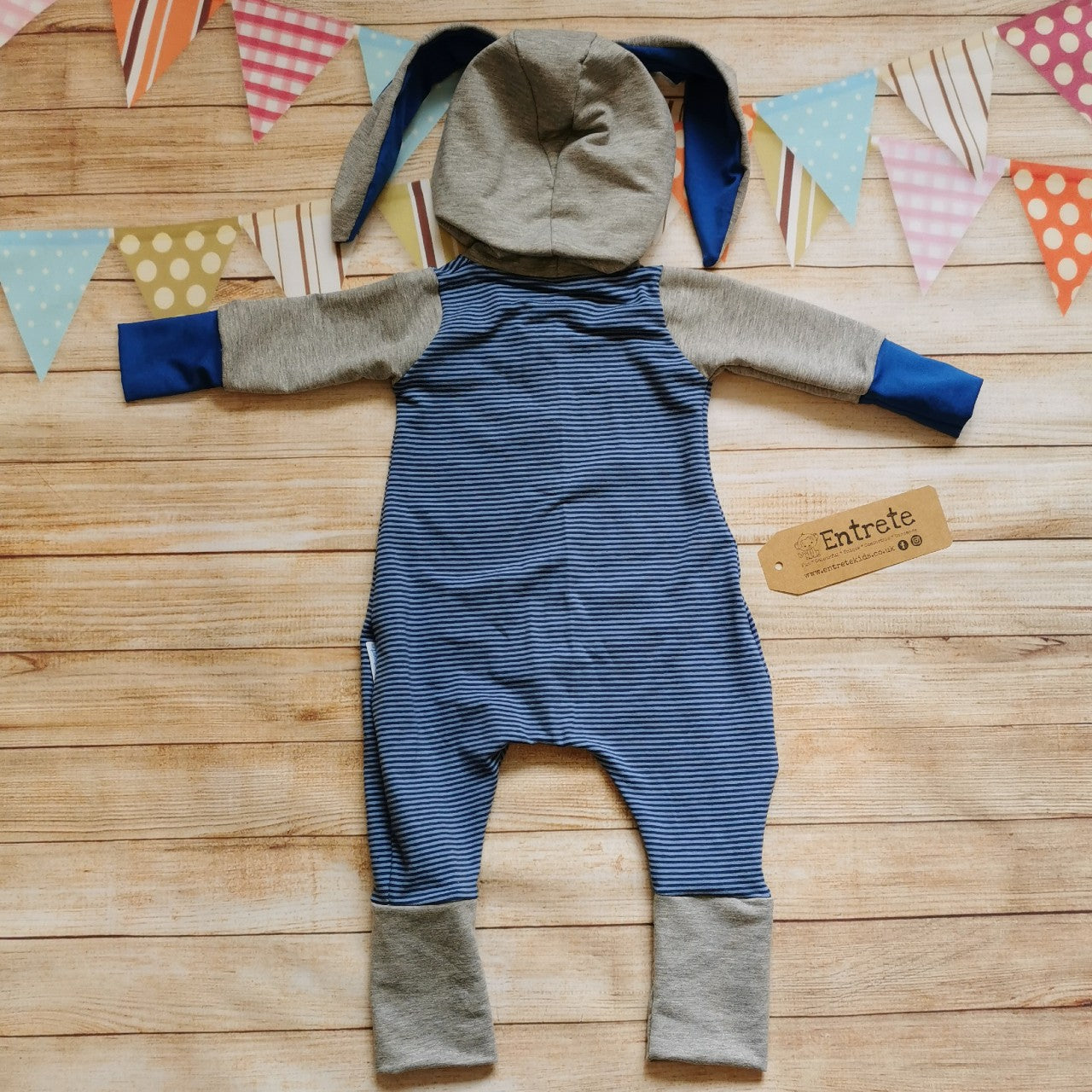 Rear of the warm, comfy and beautifully blue striped bunny romper. Handmade using cotton French terry, cotton sweat fabric and cotton jersey.