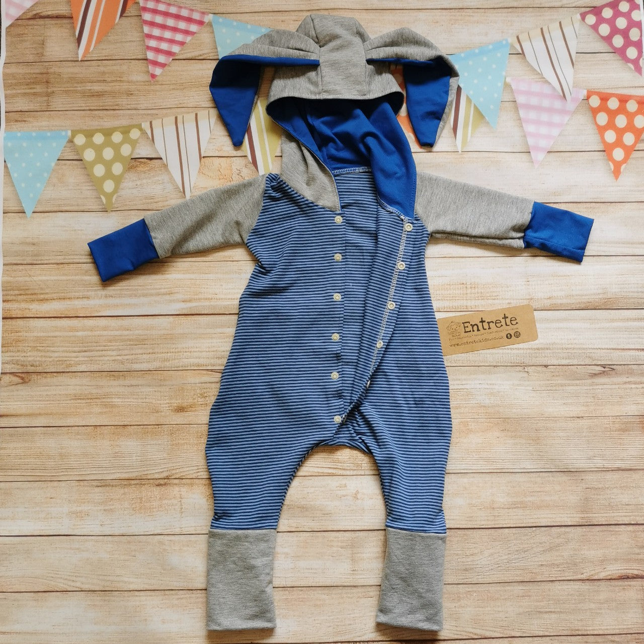 Warm, comfy and beautifully blue striped bunny romper. Handmade using cotton French terry, cotton sweat fabric and cotton jersey. Shown with easy on front popper entry open.