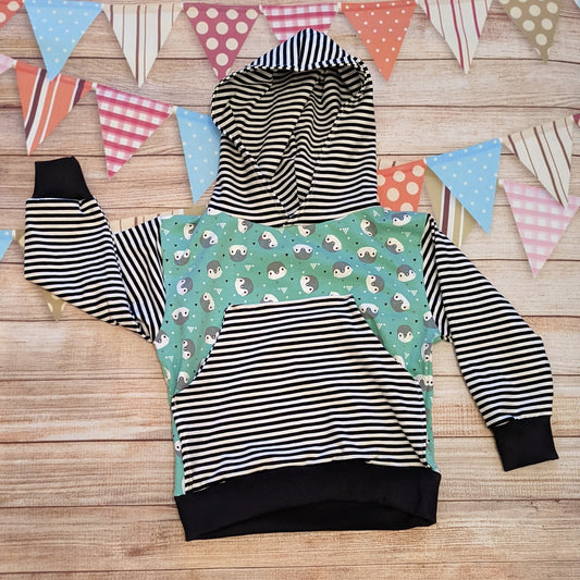 Adorable mint penguins and striped hoodie. Handmade using mint penguins organic cotton jersey, monochrome striped cotton jersey and black cotton ribbing. Featuring a striped front pocket. 