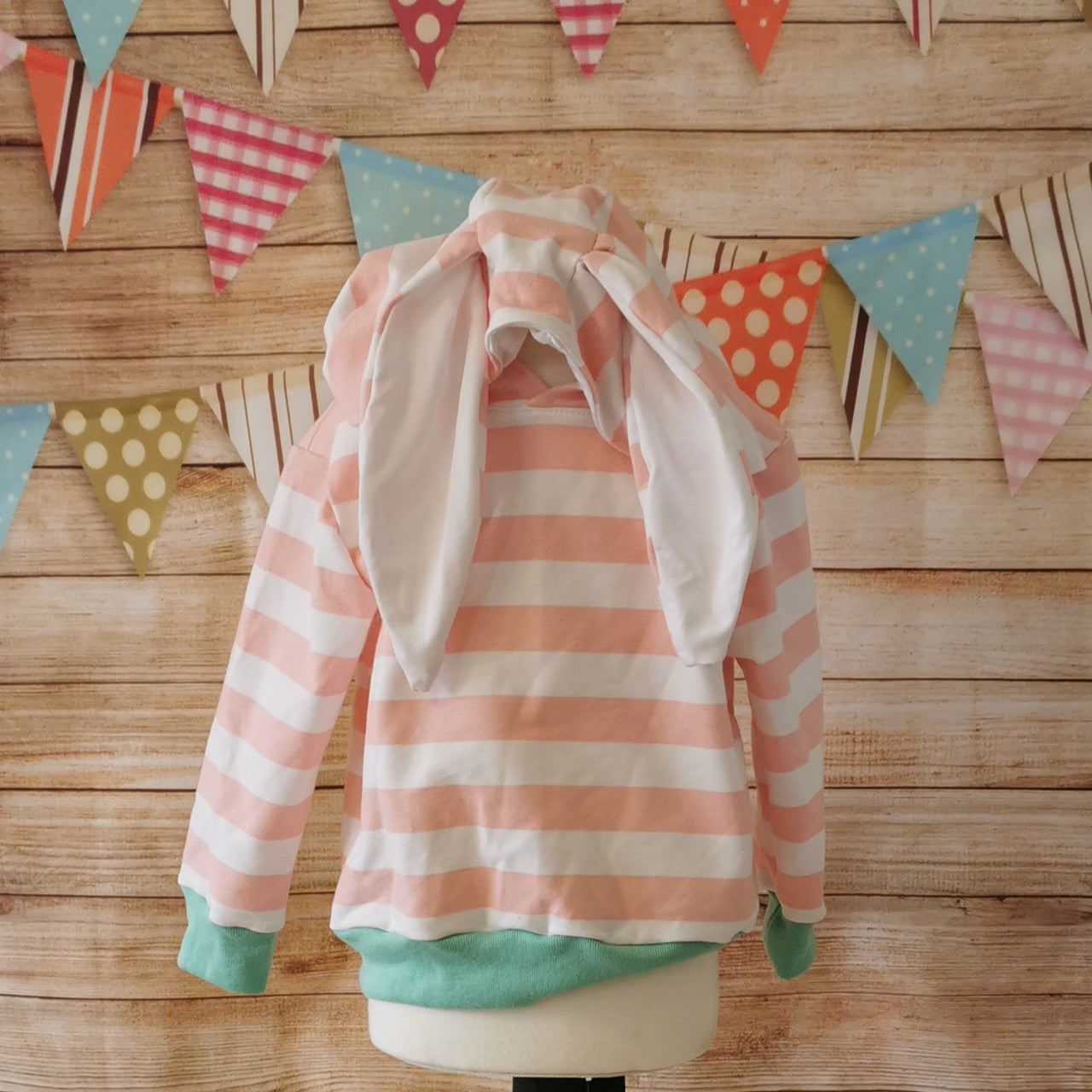 The lightweight pink striped bunny hoodie, with fun bunny ears on the hood. Handmade using pink striped cotton French terry, white cotton jersey and mint cotton ribbing. Showing bunny ears.