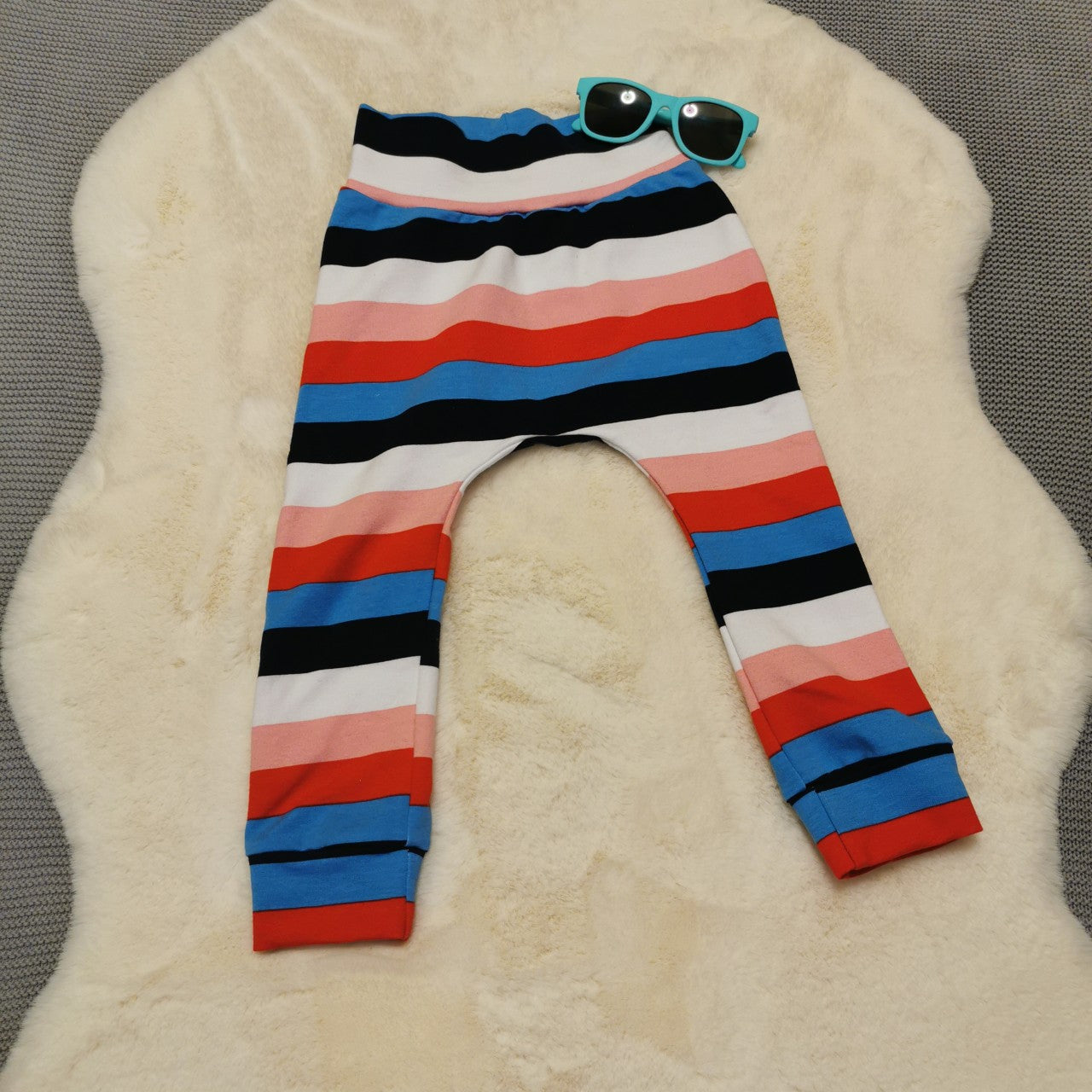 Soft, comfortable harem pants with a non-elasticated waistband perfect for younger children. Handmade using colour striped cotton jersey..