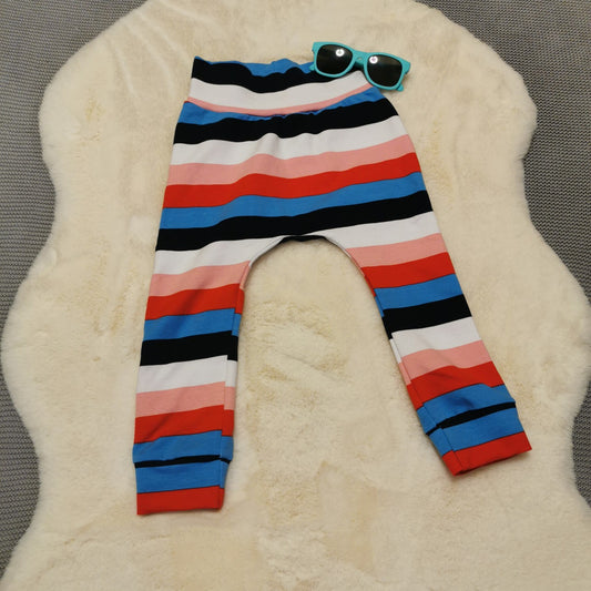 Soft, comfortable harem pants with a non-elasticated waistband perfect for younger children. Handmade using colour striped cotton jersey..