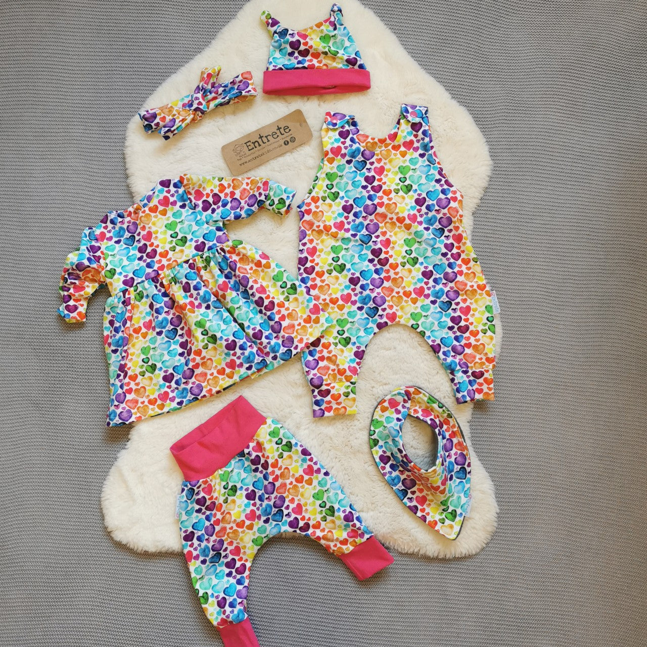 A full baby gift set shown in rainbow hearts for demonstration purposes, your gift set will be handmade using navy chicks cotton jersey.