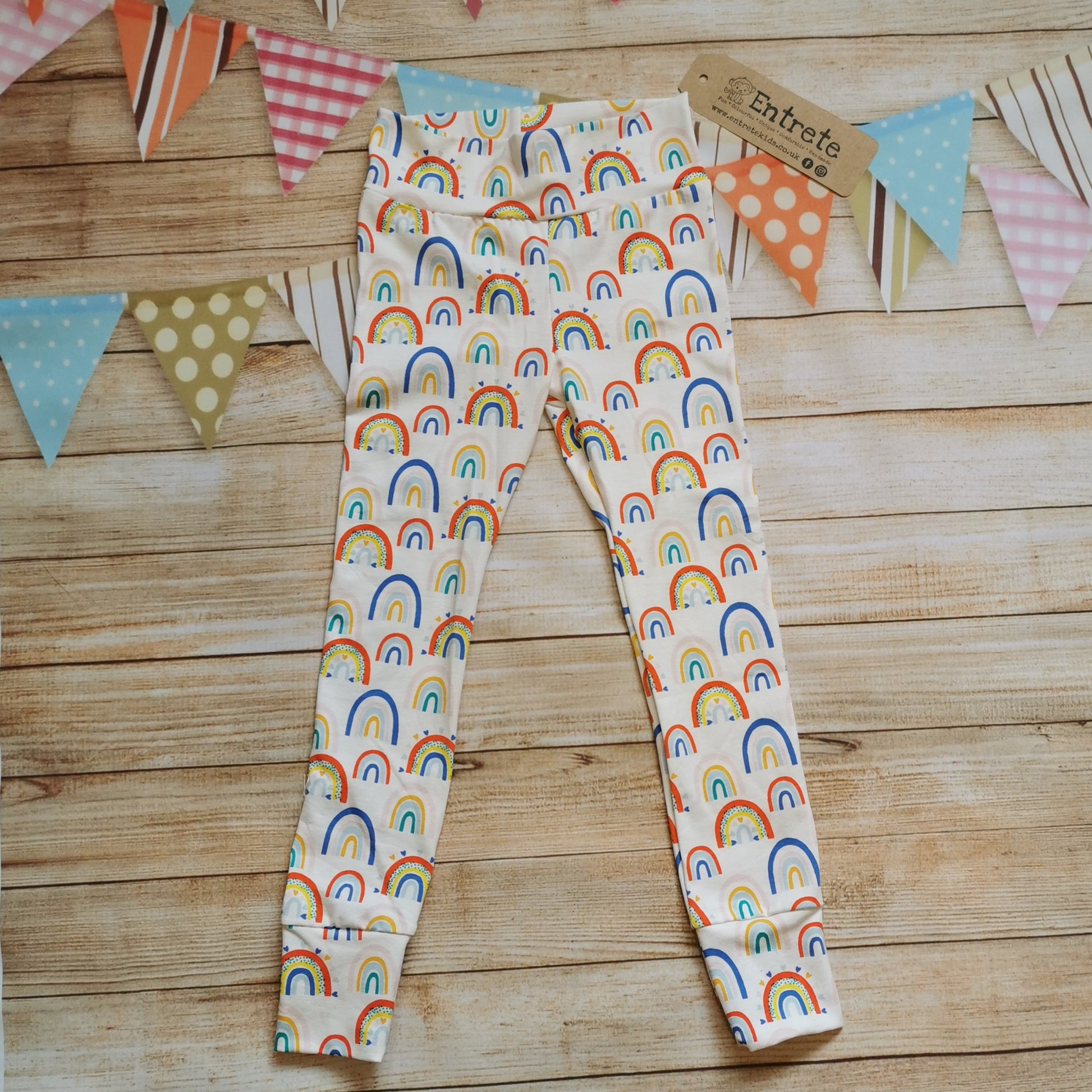 Soft and stretchy kids leggings, handmade using white colourful rainbows and hearts cotton jersey.