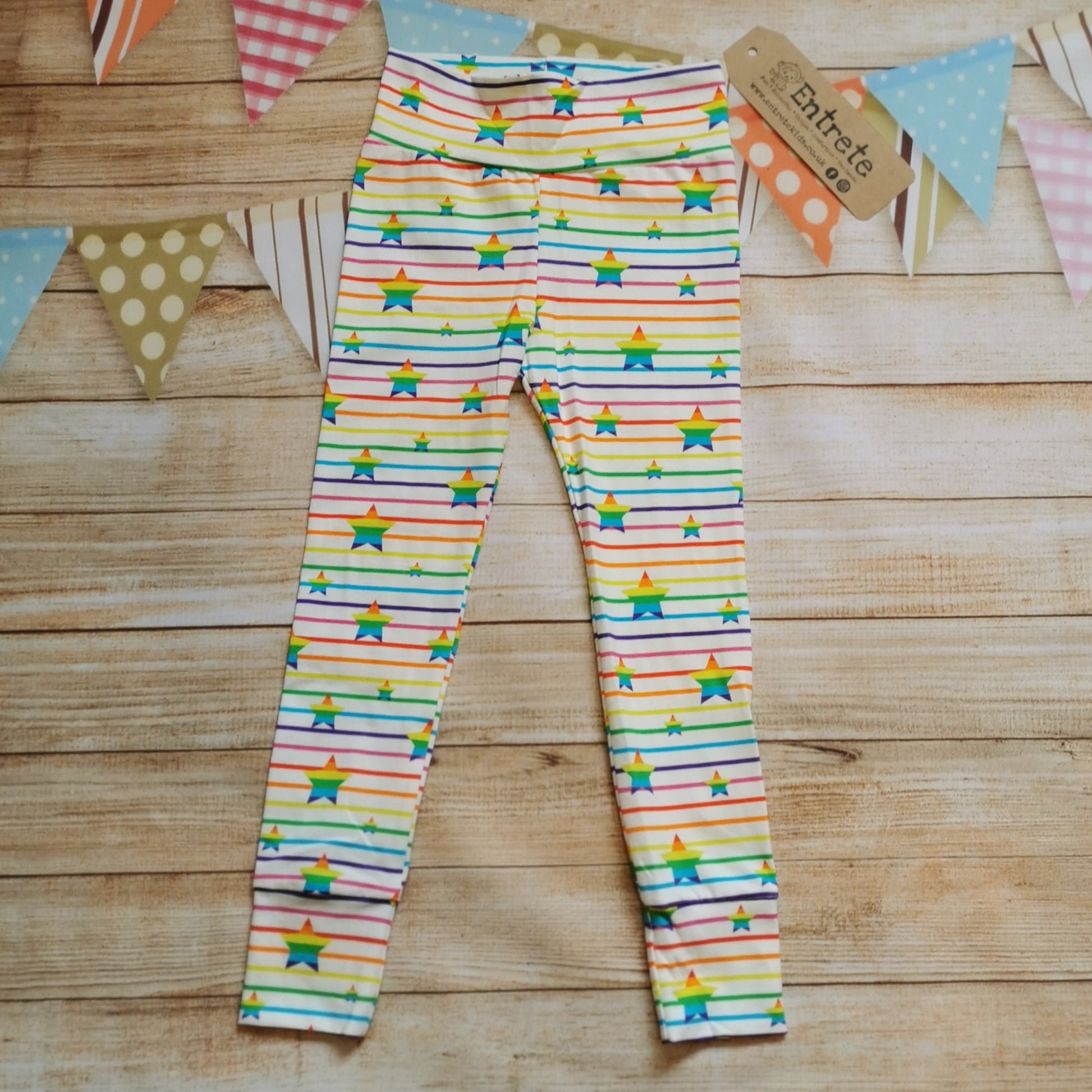 Front view of Unisex kids leggings, handmade from the colourful and fun rainbow stars cotton jersey.