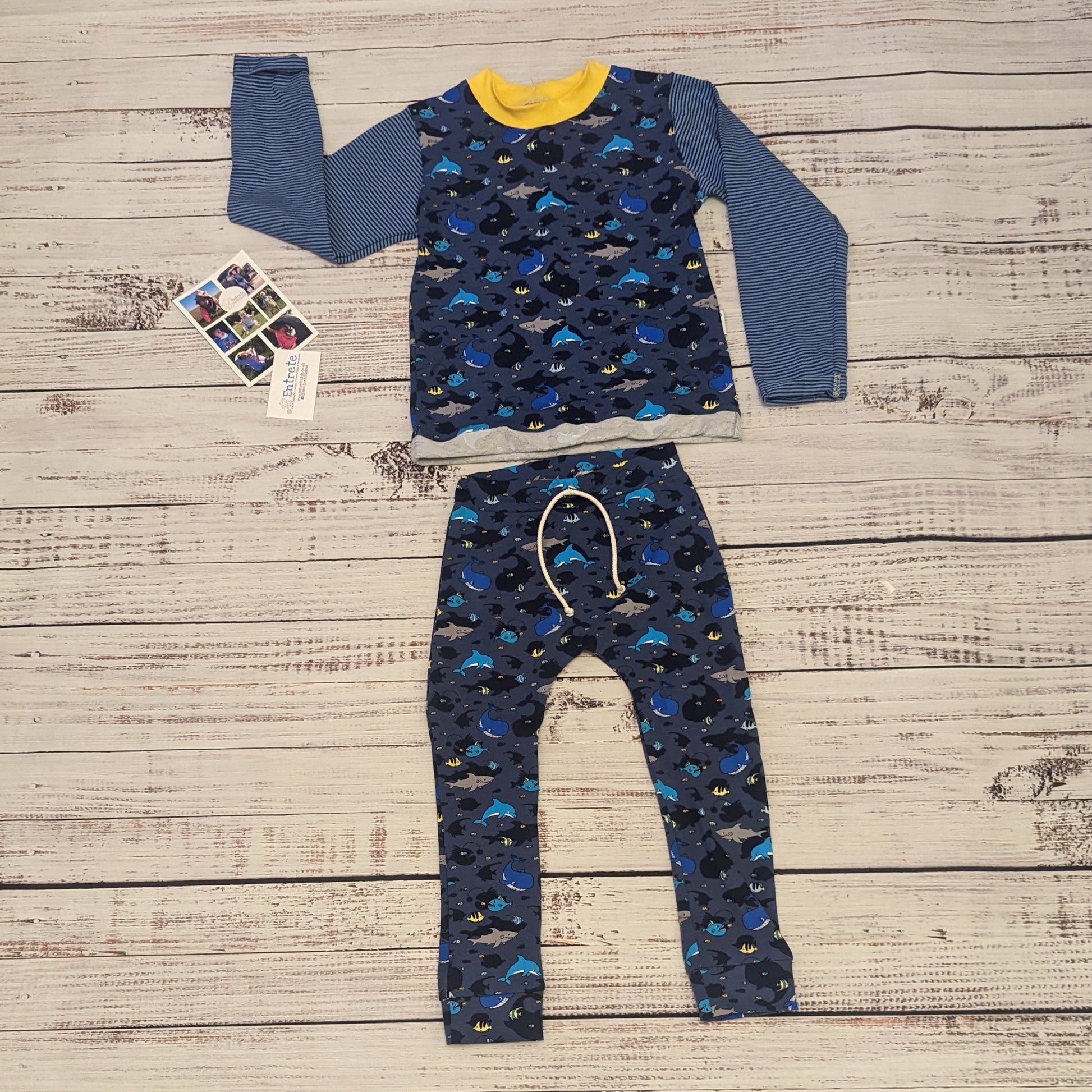 Kids navy sea creatures harem joggers. Handmade using navy sea life shadows cotton jersey. Shown as an outfit with matching long sleeve T-shirt.