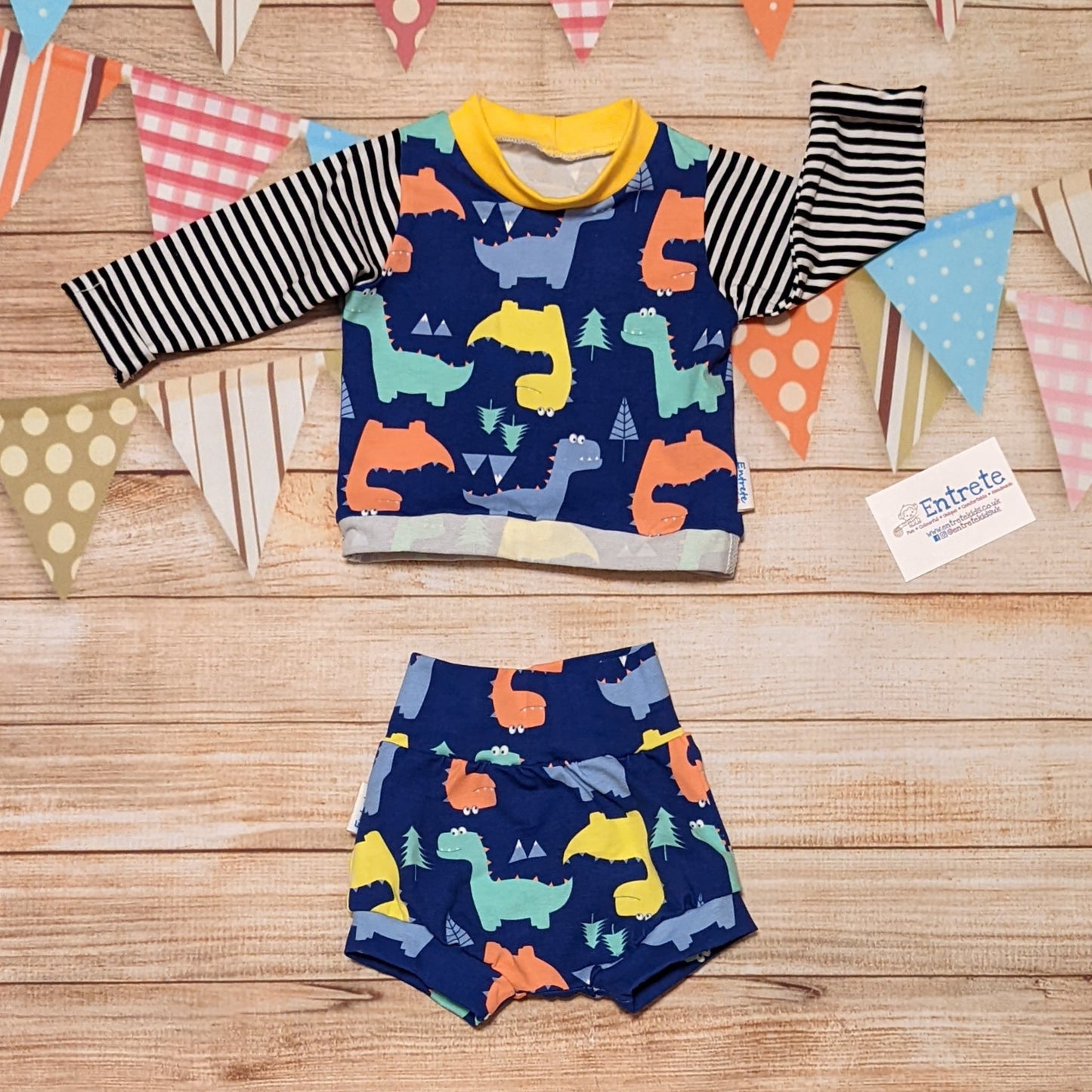 The soft, comfy and prehistorically fun blue dinosaur shorts. Shown as an outfit with a long sleeved t-shirt (sold separately)