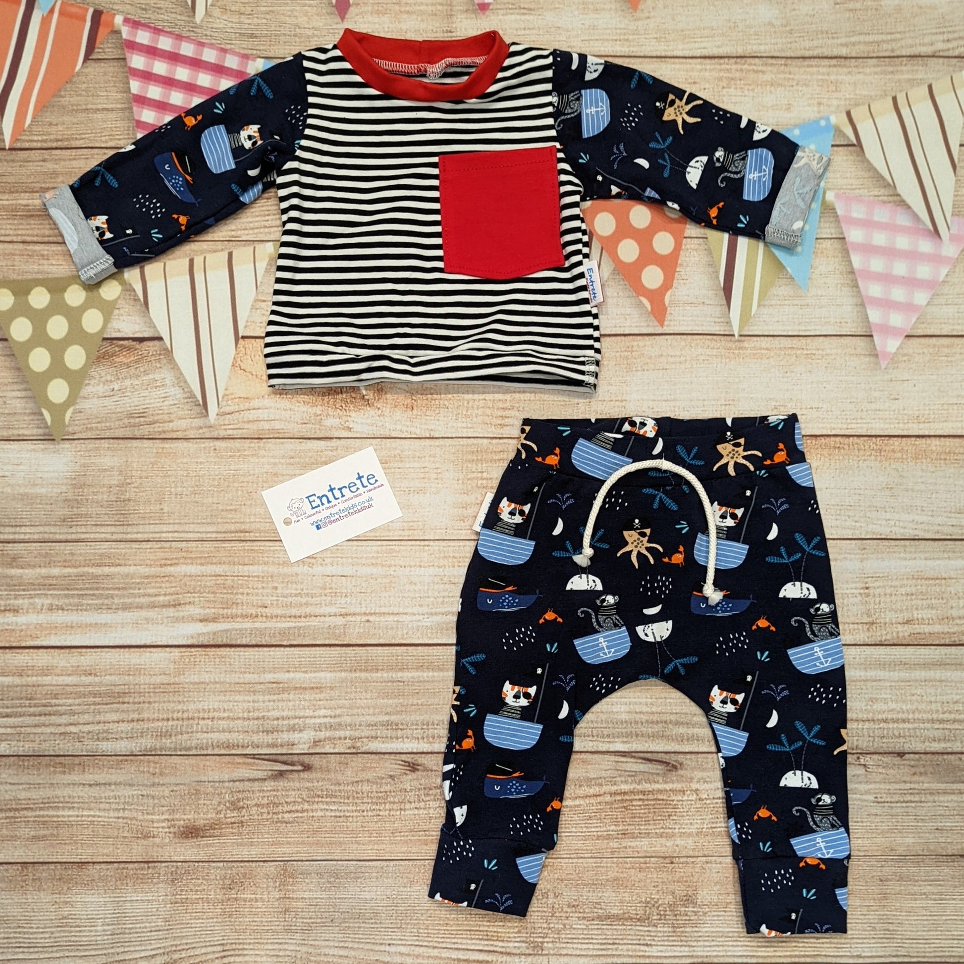 The pirate cats and striped tee shown as an outfit with pirate cats harem joggers. Perfect for your little adventurer!